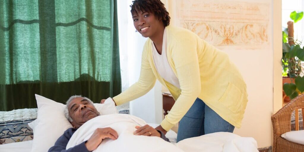 Aged care support worker with elderly person at home Logan
