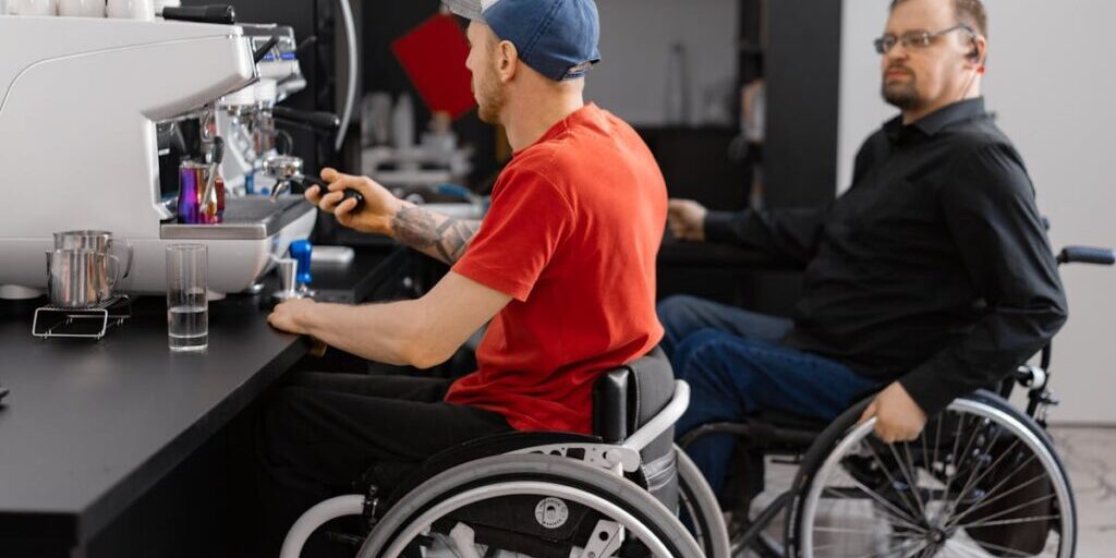 Person in wheelchair with support worker in Northern Rivers community